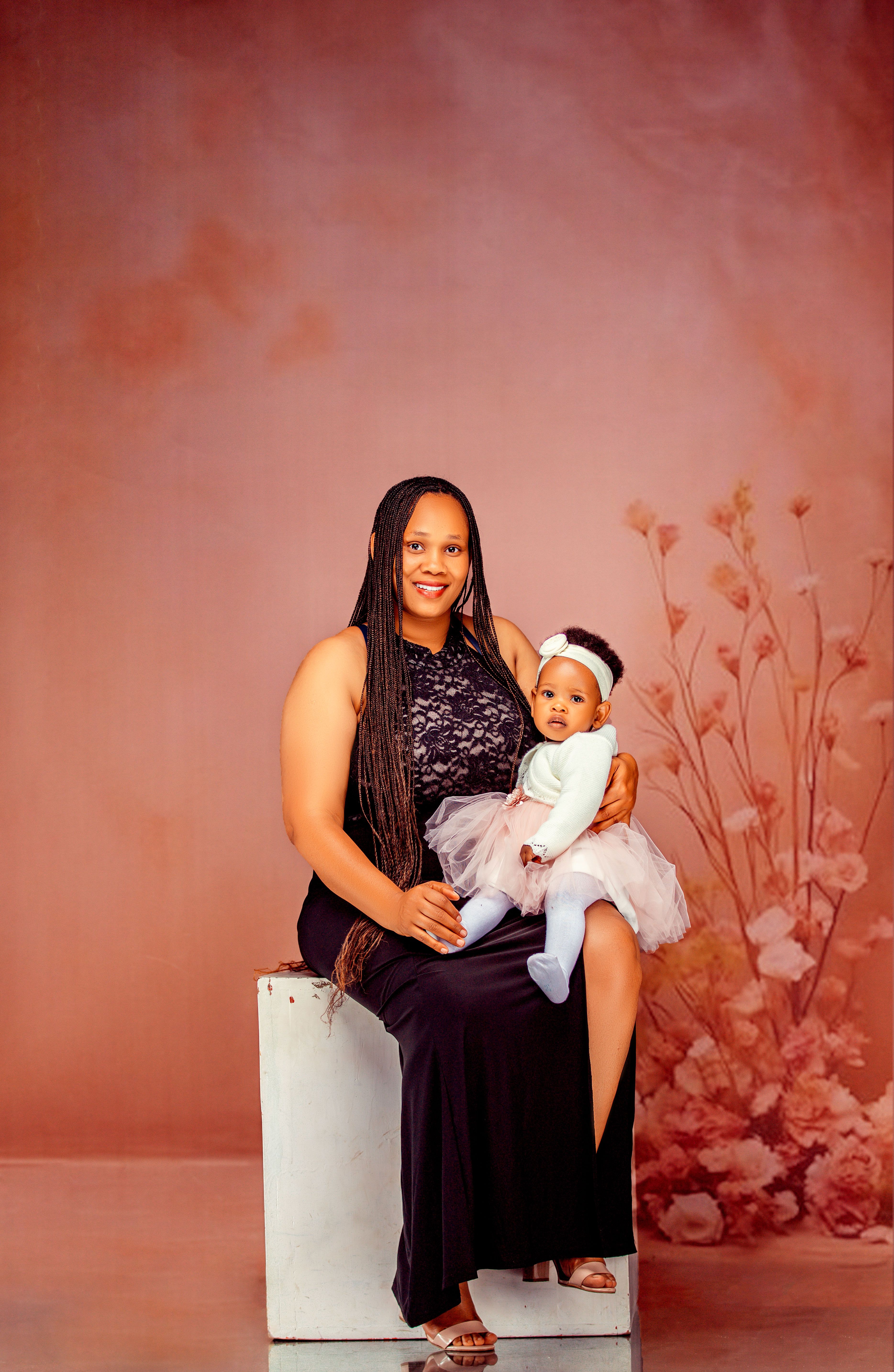 Mother and Baby Portrait in Pink Floral Studio · Free Stock Photo