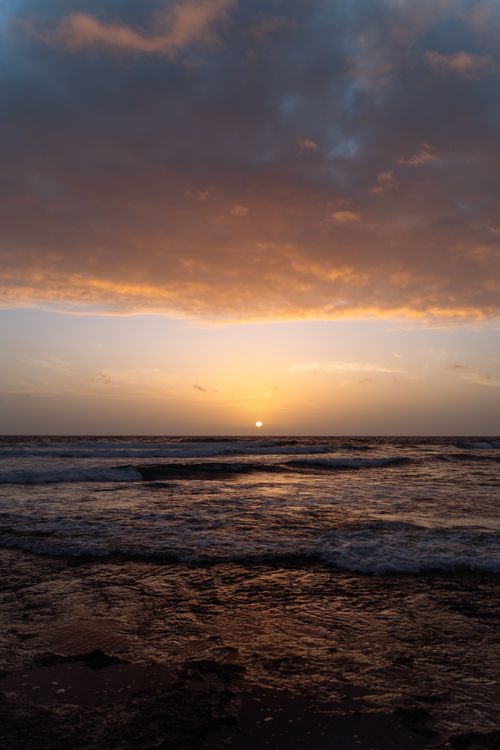 Free Breathtaking sunset over Tenerife's coast, displaying vibrant skies and serene ocean views. Stock Photo