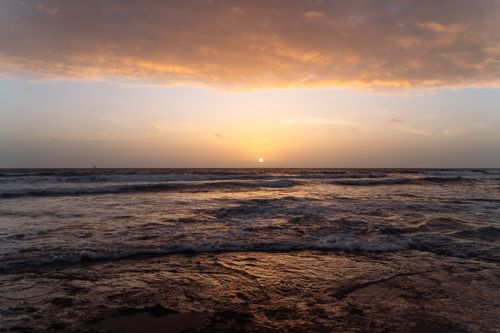 Free Beautiful sunset over the ocean waves in the Canary Islands, capturing a serene and tranquil coastal view. Stock Photo
