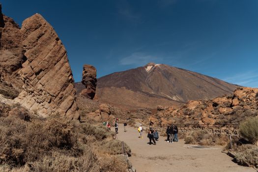 Explore the stunning volcanic landscapes of Teide National Park, Tenerife, with dramatic cliffs and rock formations.