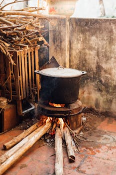 A rustic outdoor cooking setup with a pot over a wood fire in Lạng Sơn, Vietnam.
