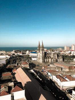 Aerial view of Fortaleza Cathedral with cityscape and ocean in the background, Brazil.