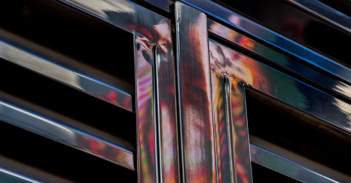 Abstract Reflection on Metallic Surface Panels · Free Stock Photo