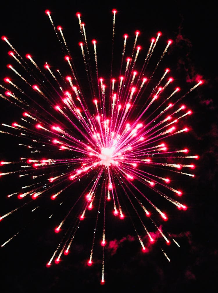 Red Firework In Dark Sky