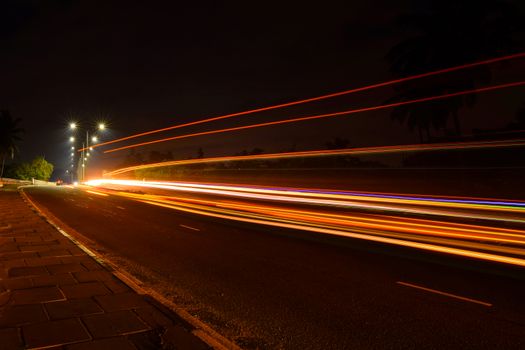 Dynamic long exposure shot of lights on a road at night in Kaduwela, Sri Lanka.