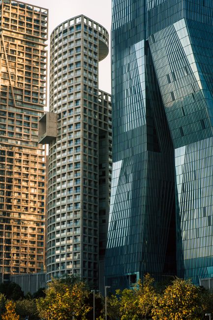 Striking architectural shot of modern high-rise buildings with unique designs.