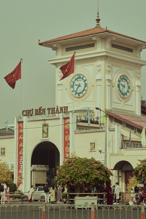 Free Historic Ben Thanh Market with flags in Ho Chi Minh City, Vietnam. Iconic architectural landmark. Stock Photo