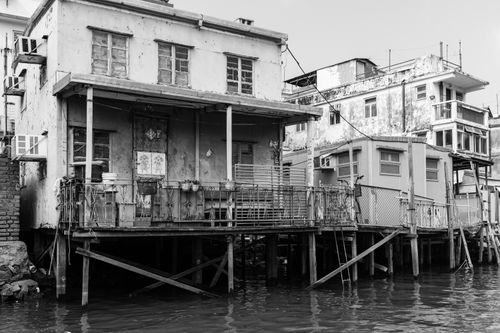 Free Black and white image of traditional stilt houses in Tai O, capturing rustic architecture. Stock Photo