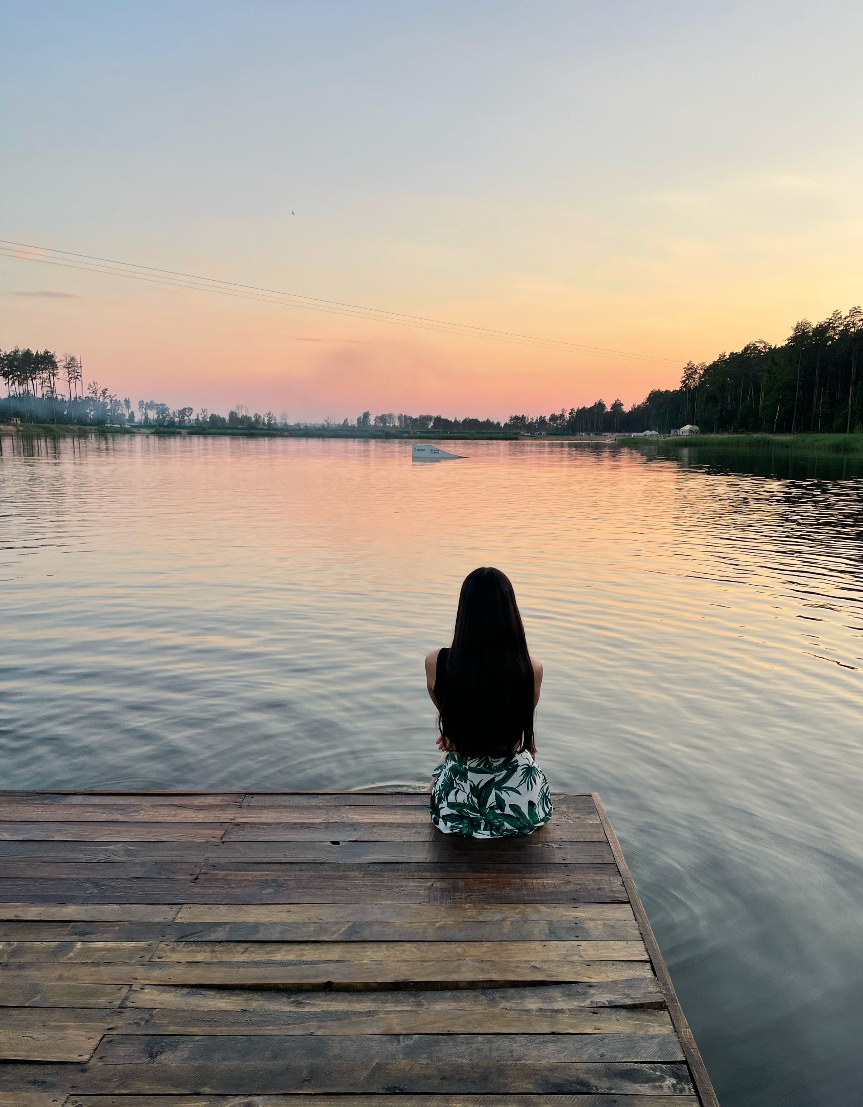 Peaceful Sunset Lake View with Woman on Dock · Free Stock Photo