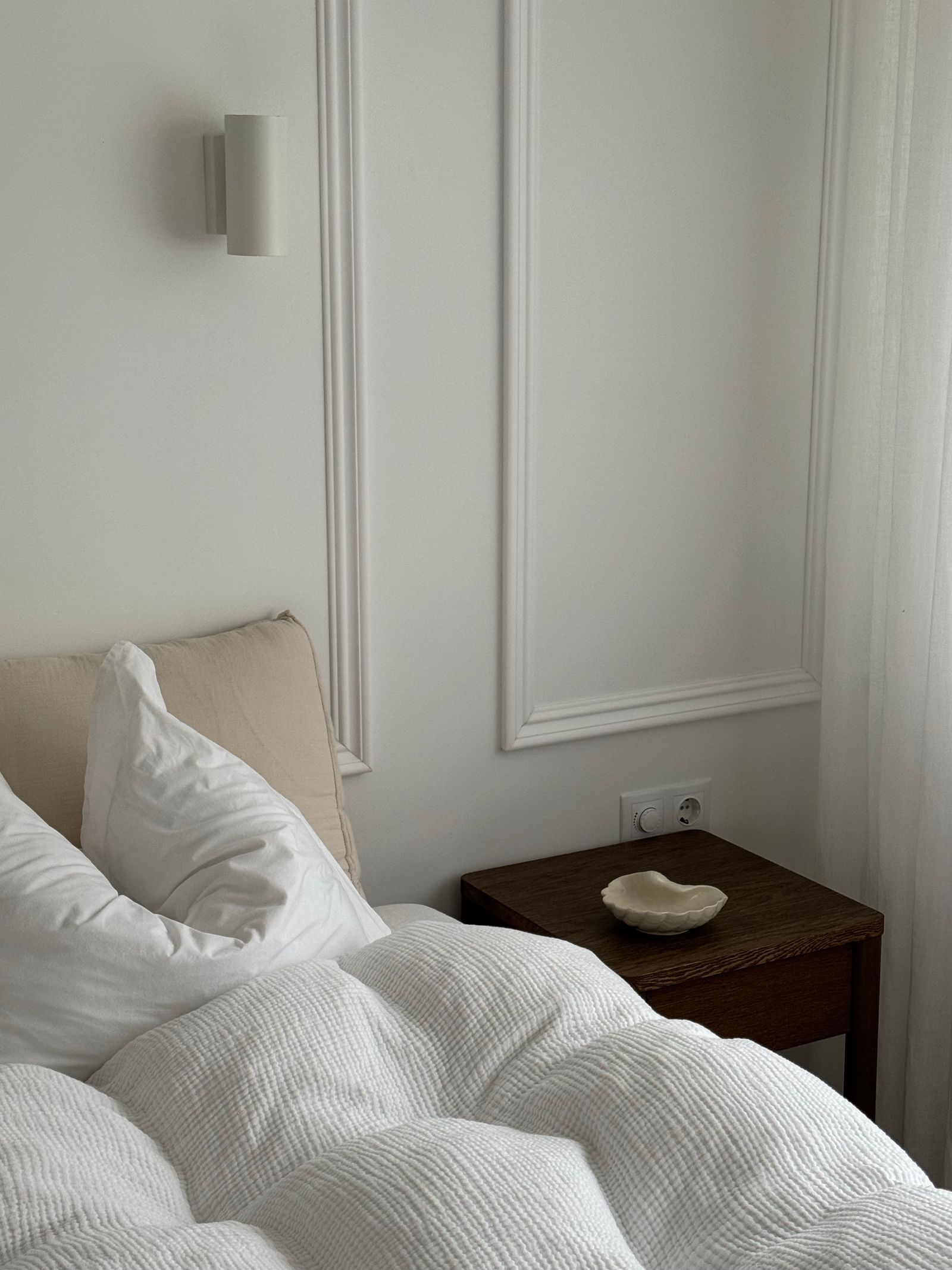 Premium white bedding styled in a calm bedroom