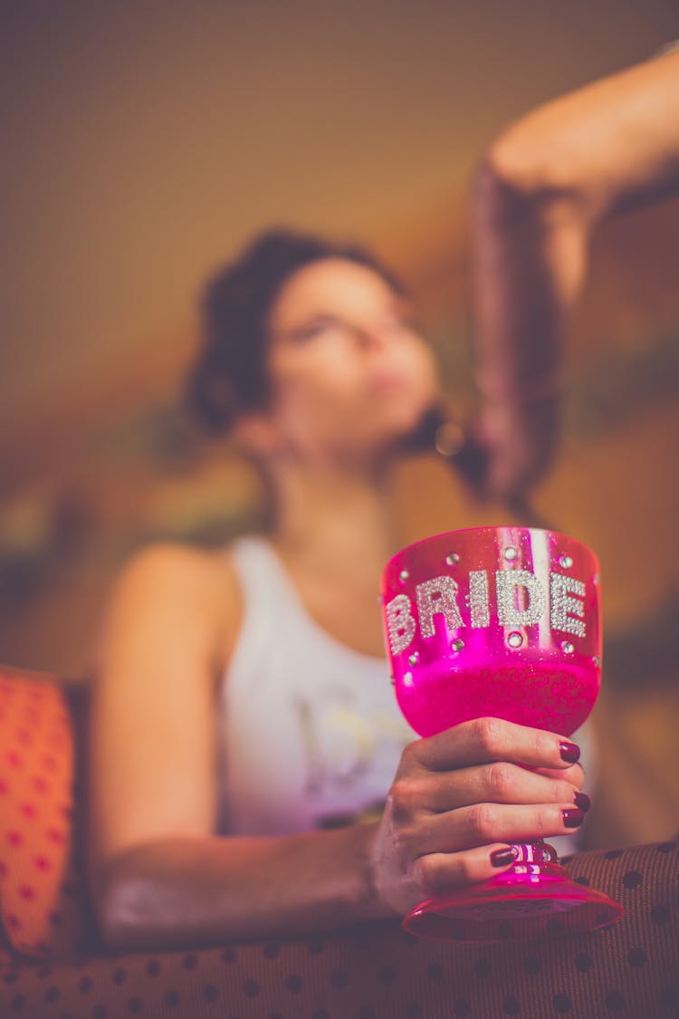 Selective Focus Photo Of Pink Bride Goblet