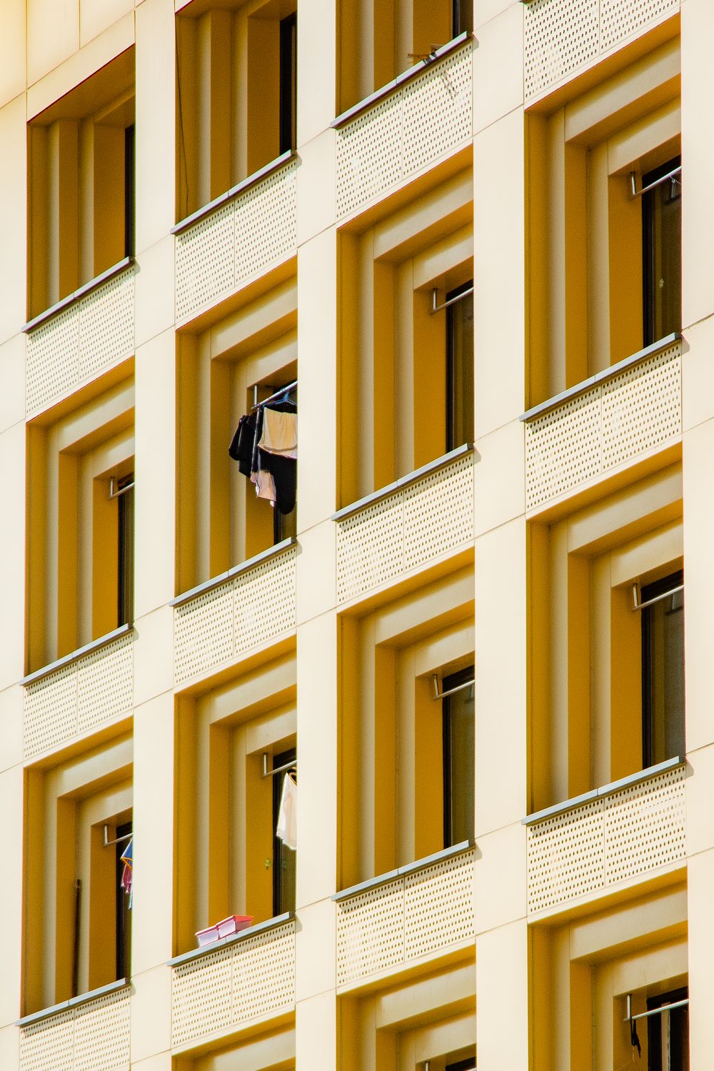 Modern Building Facade with Open Windows · Free Stock Photo
