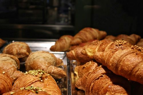 Free A tempting display of fresh croissants in a Milano bakery, perfect for breakfast. Stock Photo