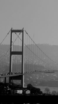Dramatic black and white capture of the Bosphorus Bridge, Istanbul.