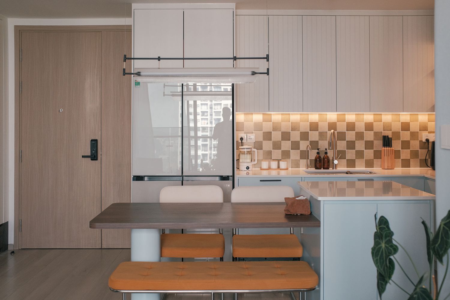 Minimalist architectural kitchen with fluted cabinetry and granite counter
