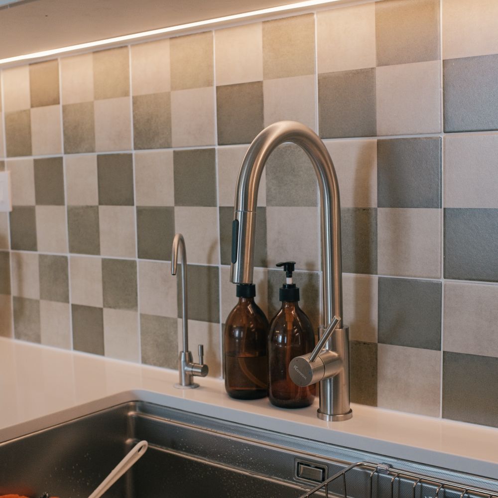 Kitchen Spraying in Rainham — a decorator at work mid-project