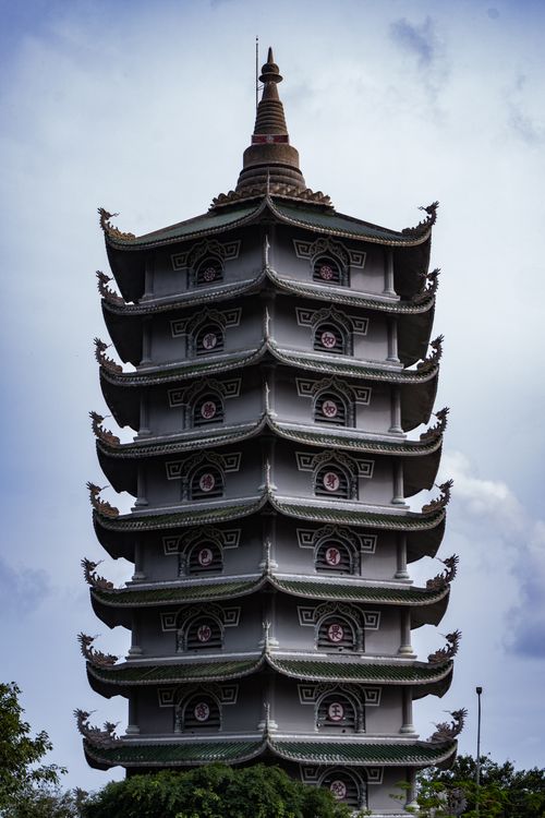 Free A traditional multi-tiered pagoda tower captured against a cloudy sky, evoking cultural heritage. Stock Photo