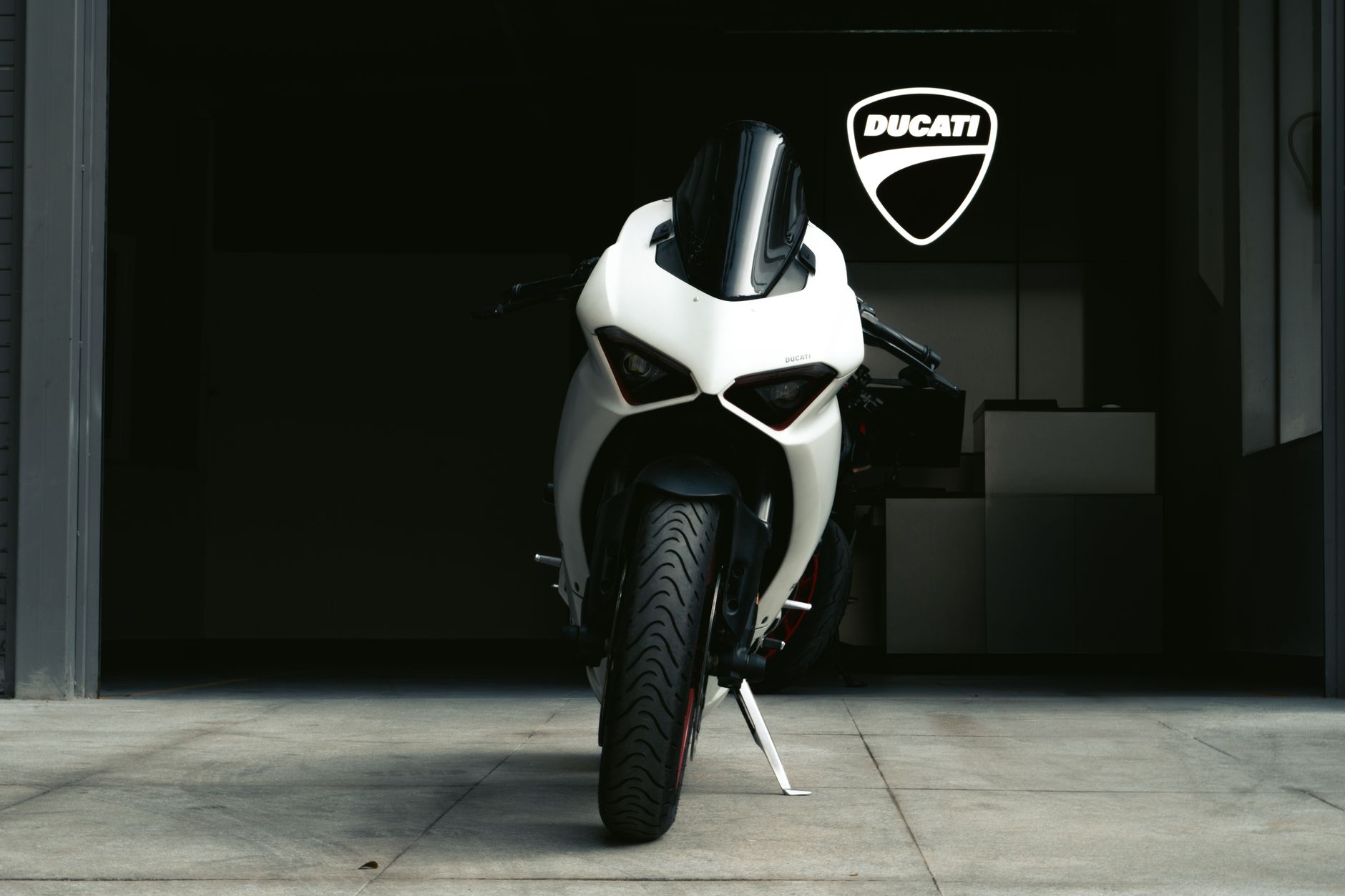 The Centenario showcases its extensive carbon fiber construction and WorldSBK-derived aerodynamics, a testament to Ducati's engineering.