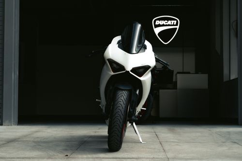 Free A striking front view of a Ducati motorcycle showcased in a Bengaluru showroom. Stock Photo