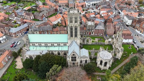 Free Aerial view of the historic Beverley Minster surrounded by quaint English townhouses. Stock Photo