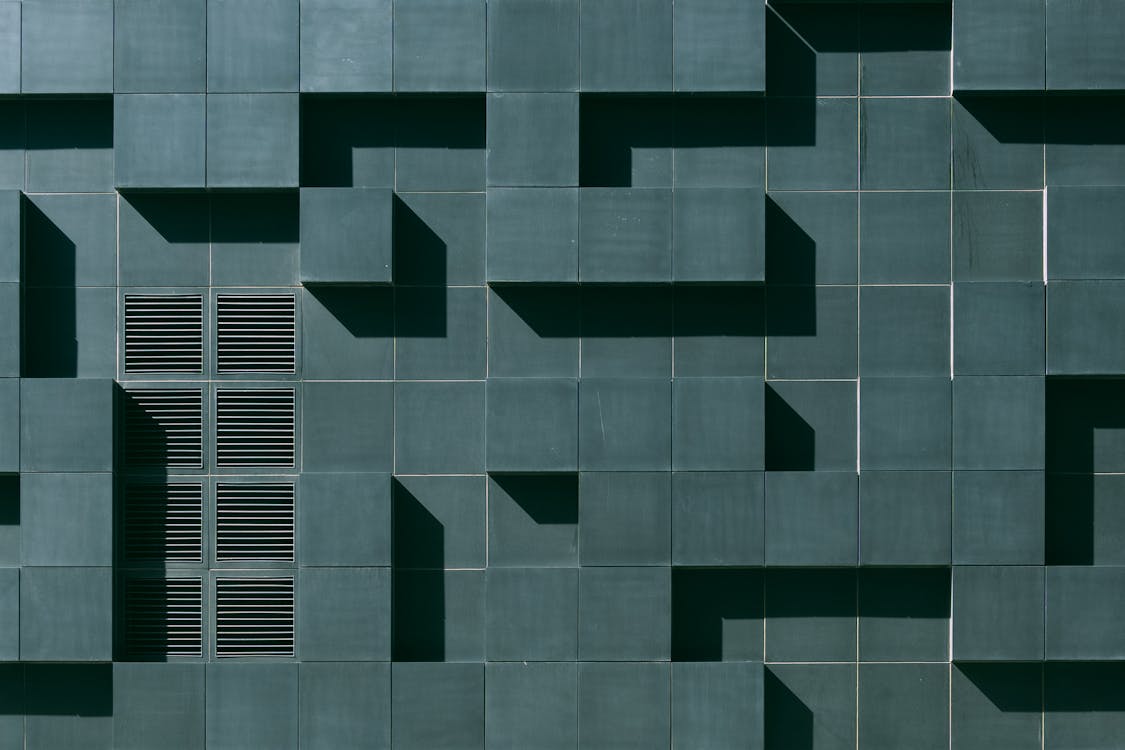 Free Gray Concrete Building Exterior With Geometric Design Stock Photo