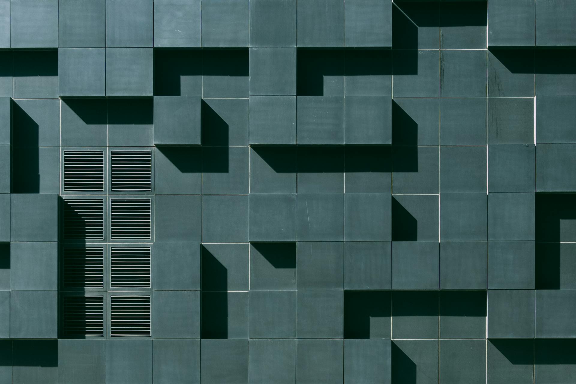 Gray Concrete Building Exterior With Geometric Design