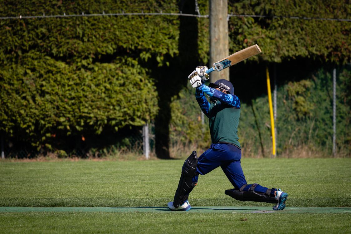 Cricketer Pic Dynamic Cricket Player in Action on the Field · Free Stock Photo