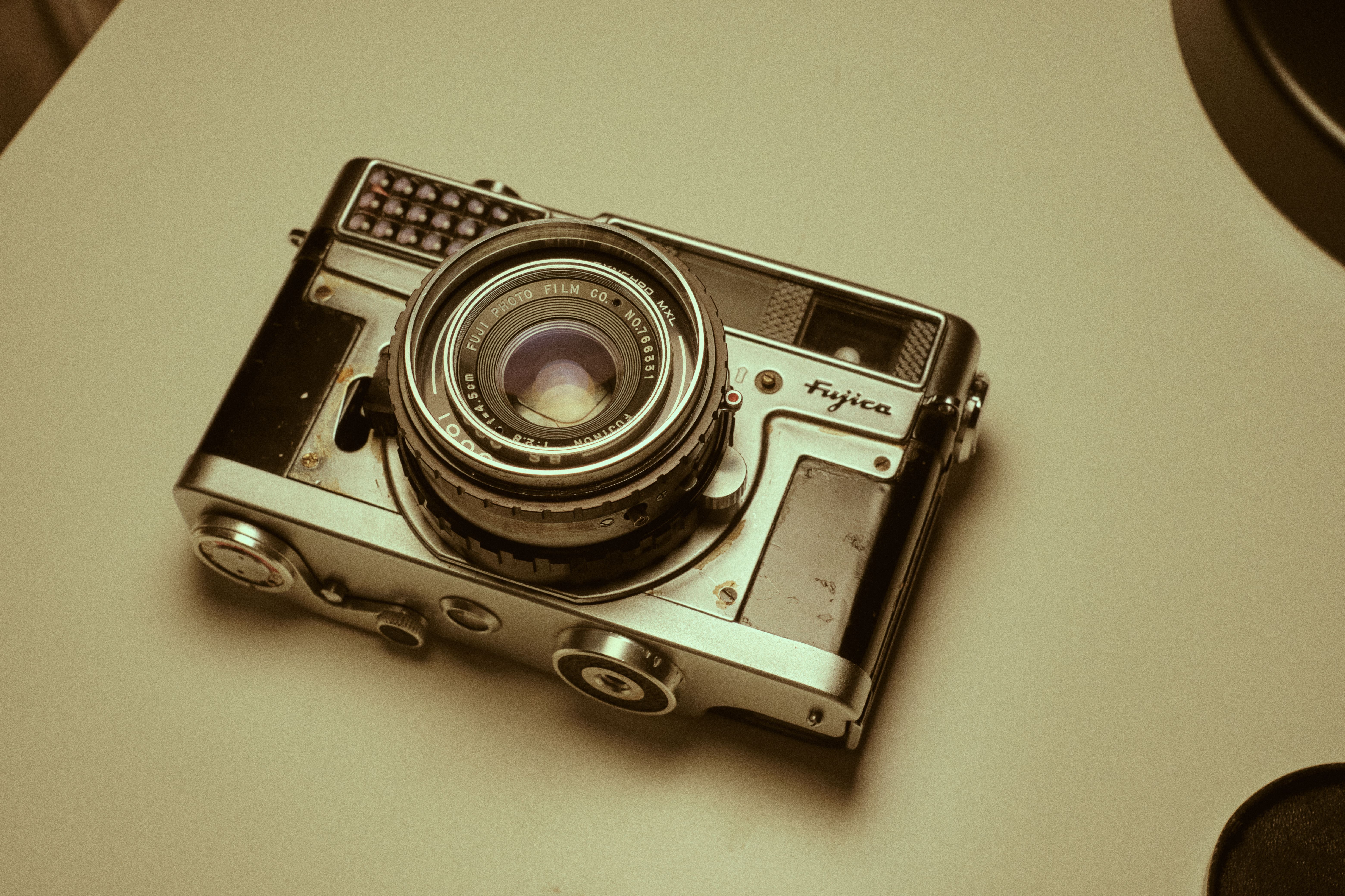 Close-up shot of a vintage Fujica film camera with a retro tone, perfect for photography enthusiasts.