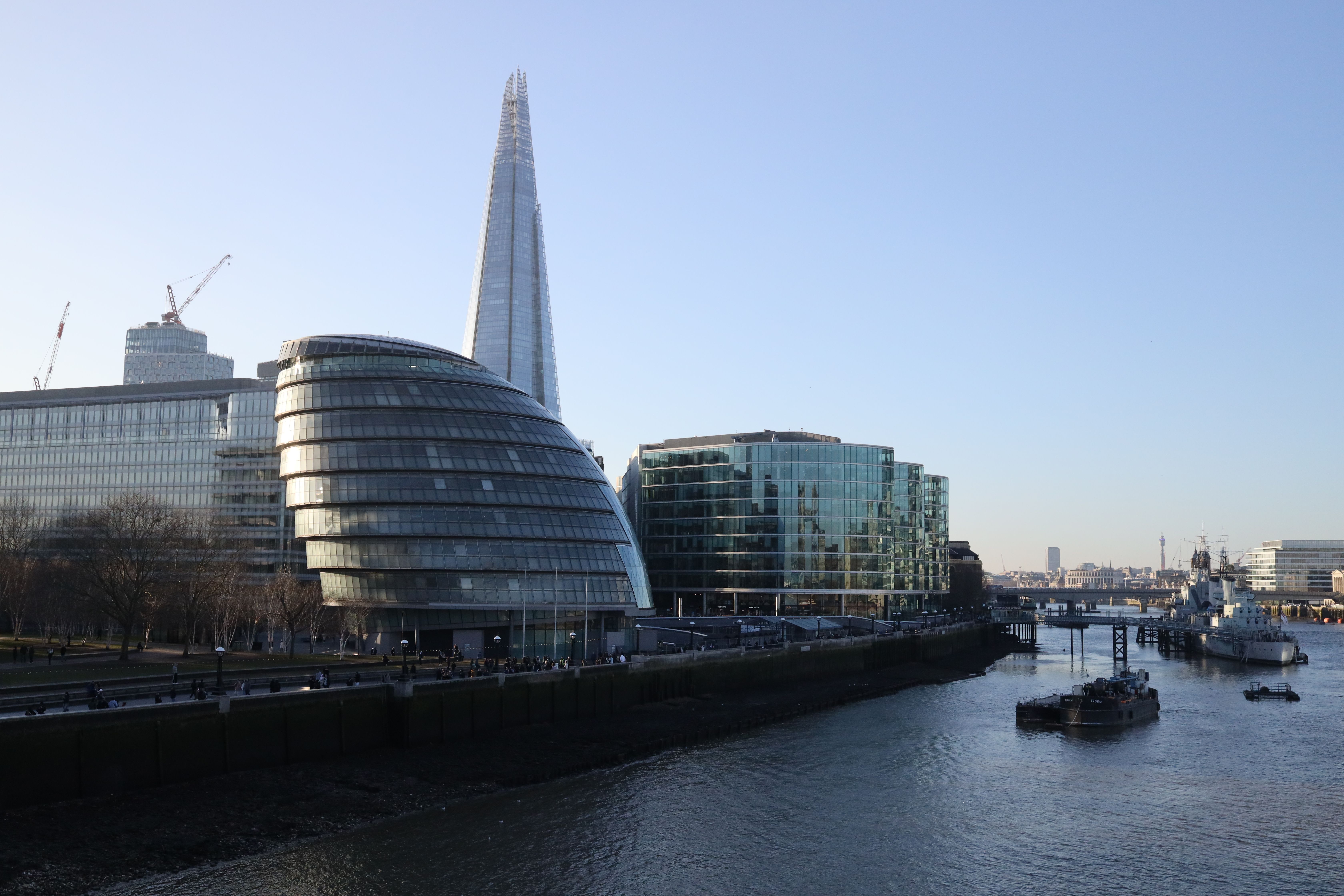Stunning view of modern architecture by the River Thames, highlighting The Shard in London.