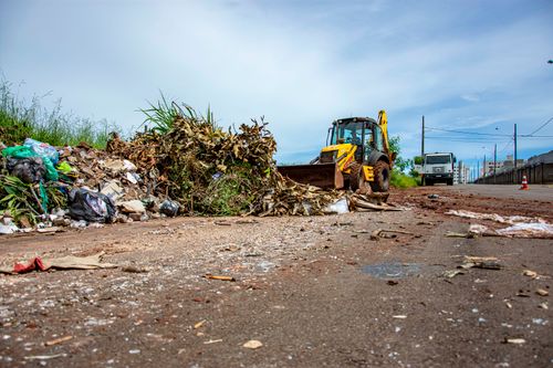 Free Street cleaning operation with bulldozer and debris in Londrina, Brazil. Stock Photo