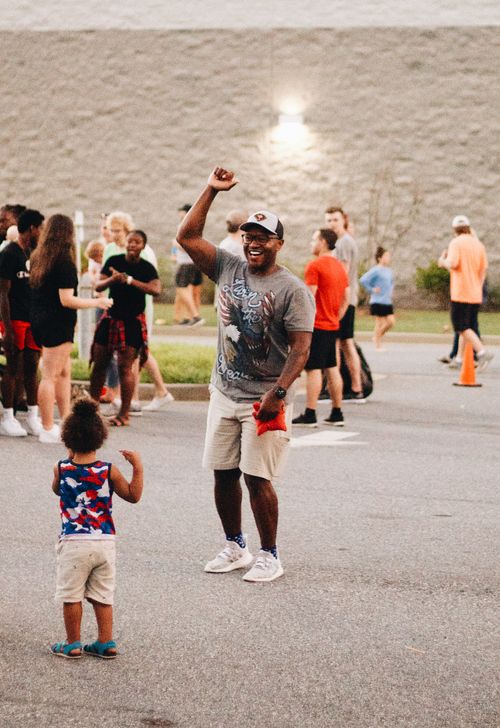 Free Joyful community gathering with people enjoying outdoor summer festivities in Clemson. Stock Photo
