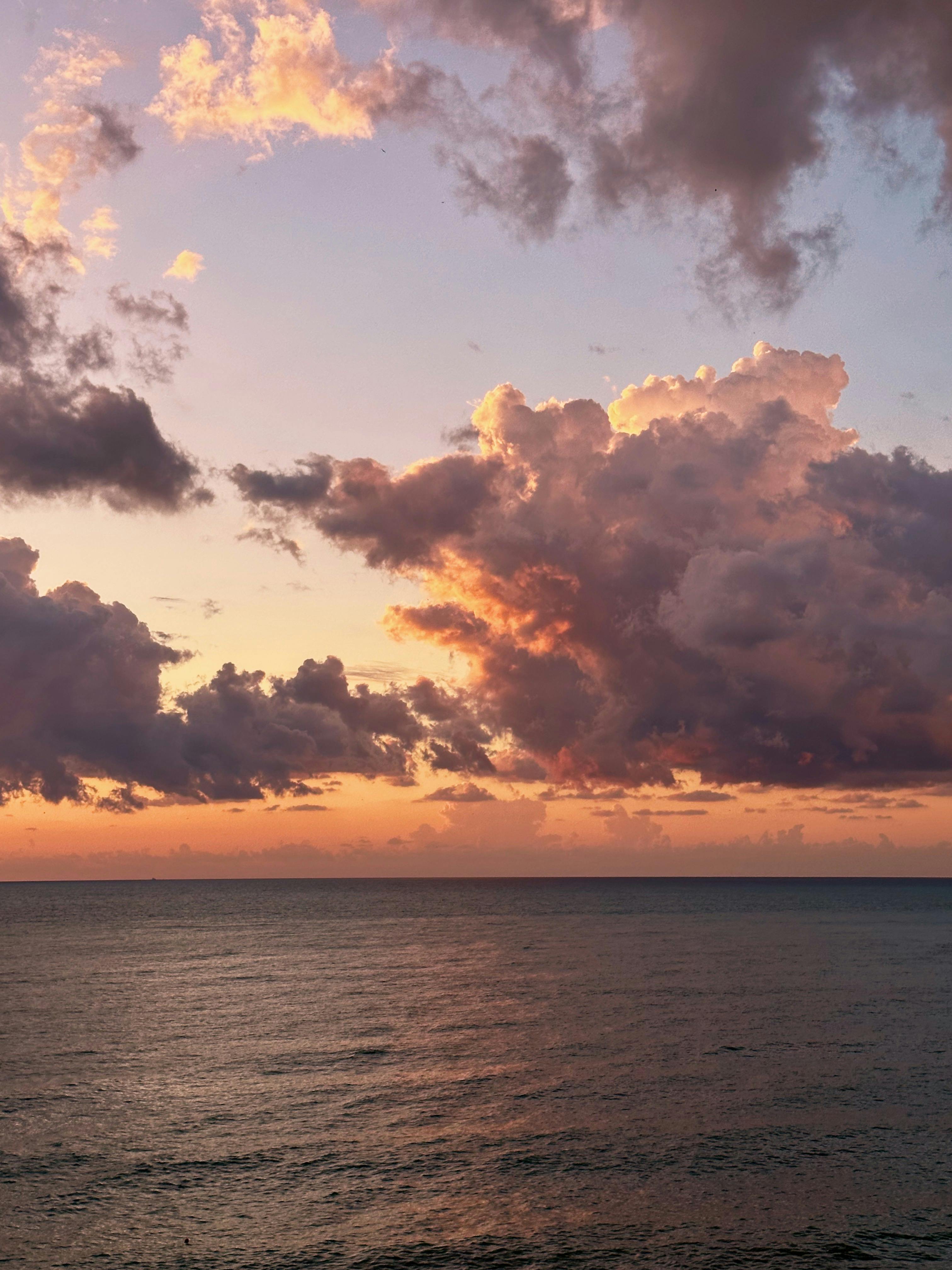 Vibrant sunset with dramatic clouds over the Black Sea in Batumi, Georgia.