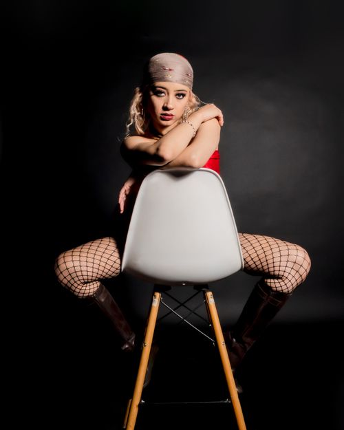 Free Dynamic pose of a contemporary dancer in studio lighting, showcasing expression and attitude. Stock Photo