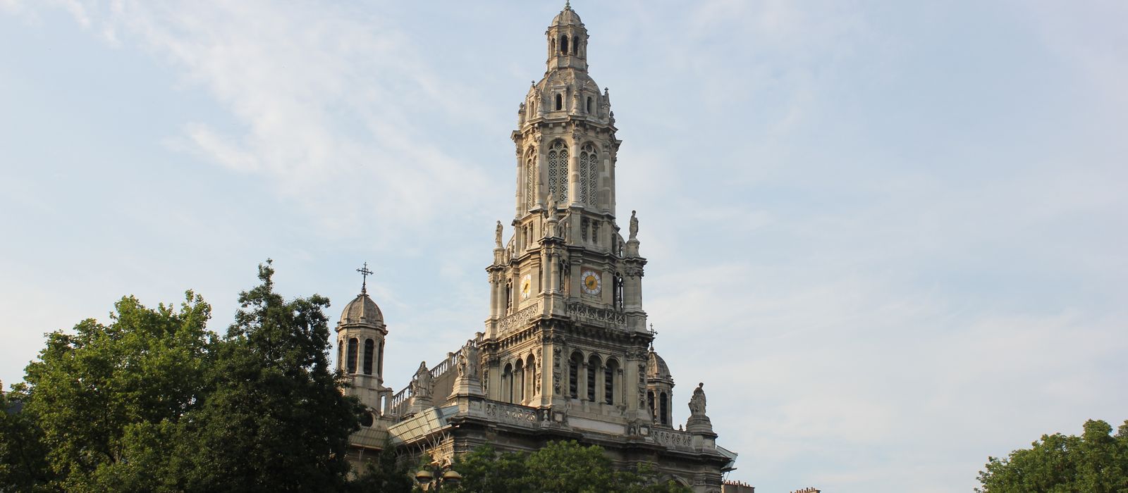Historic Eglise de la Sainte-Trinité church in Paris with clear sky.