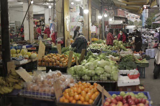 A vibrant street market scene with fresh vegetables and fruits, showcasing local trade.