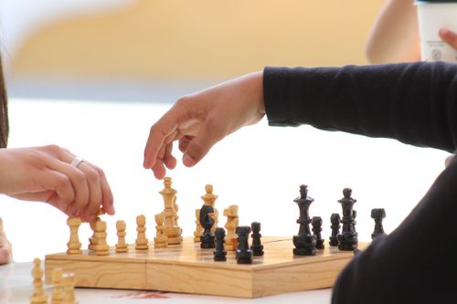 Free Two players strategizing during a chess game, focusing on moves. Stock Photo