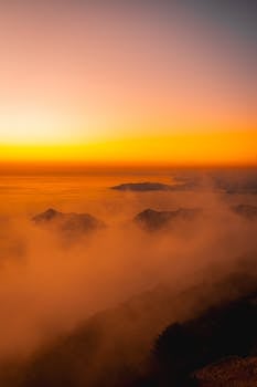 Breathtaking sunrise over misty mountains in Fethiye, Türkiye.