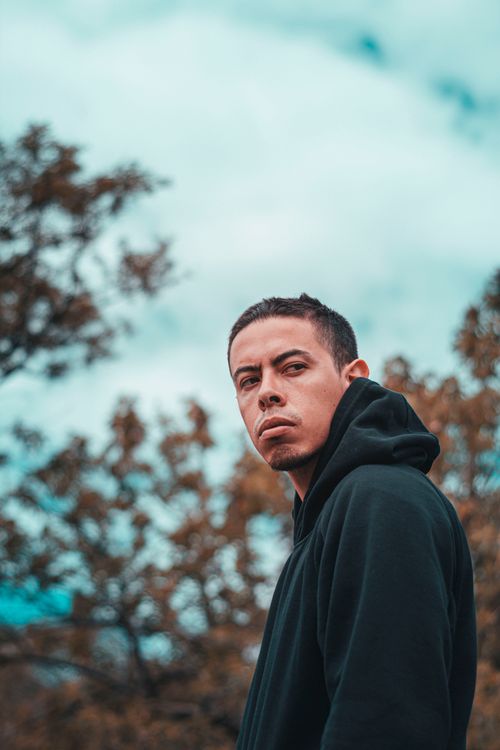 Free Portrait of a man in a black hoodie outdoors in Guanajuato, Mexico. Stock Photo