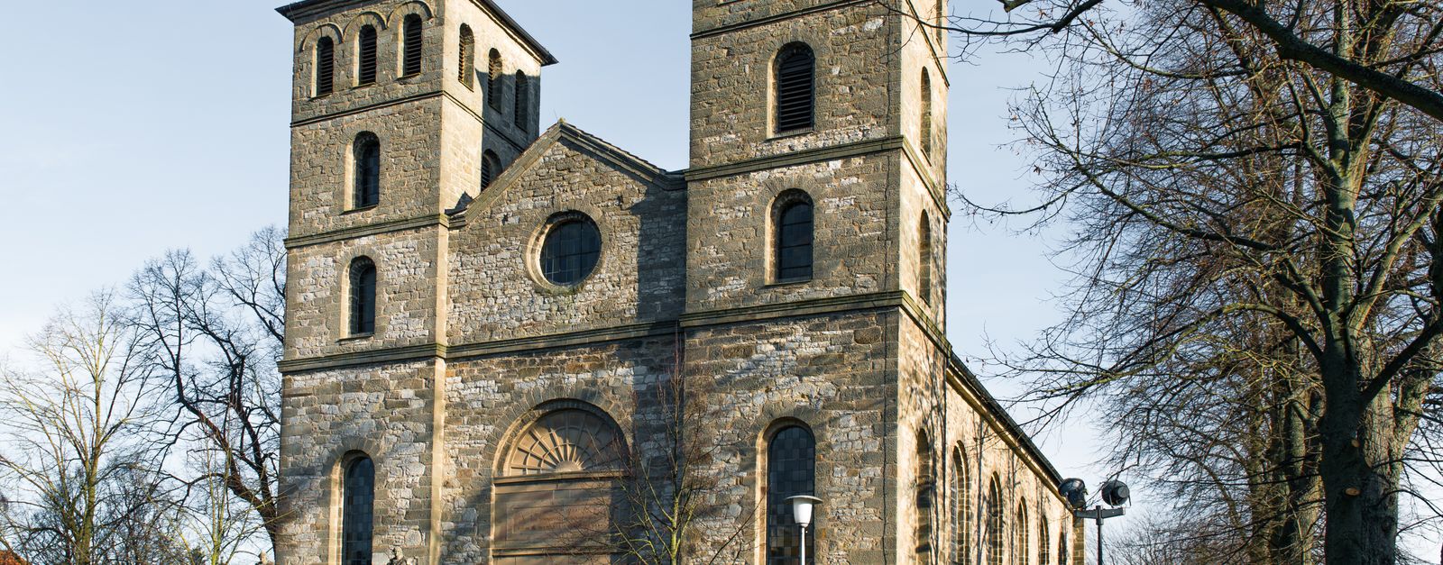 Captivating view of a historic church in Warburg, Germany showcasing two clock towers.