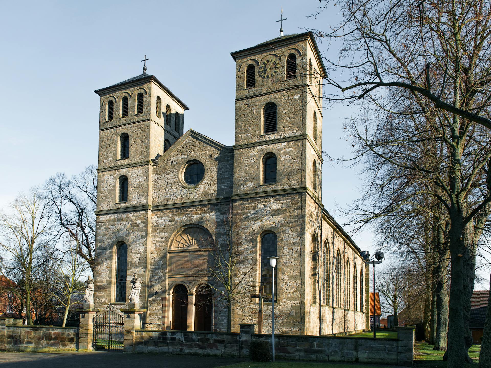 Captivating view of a historic church in Warburg, Germany showcasing two clock towers.