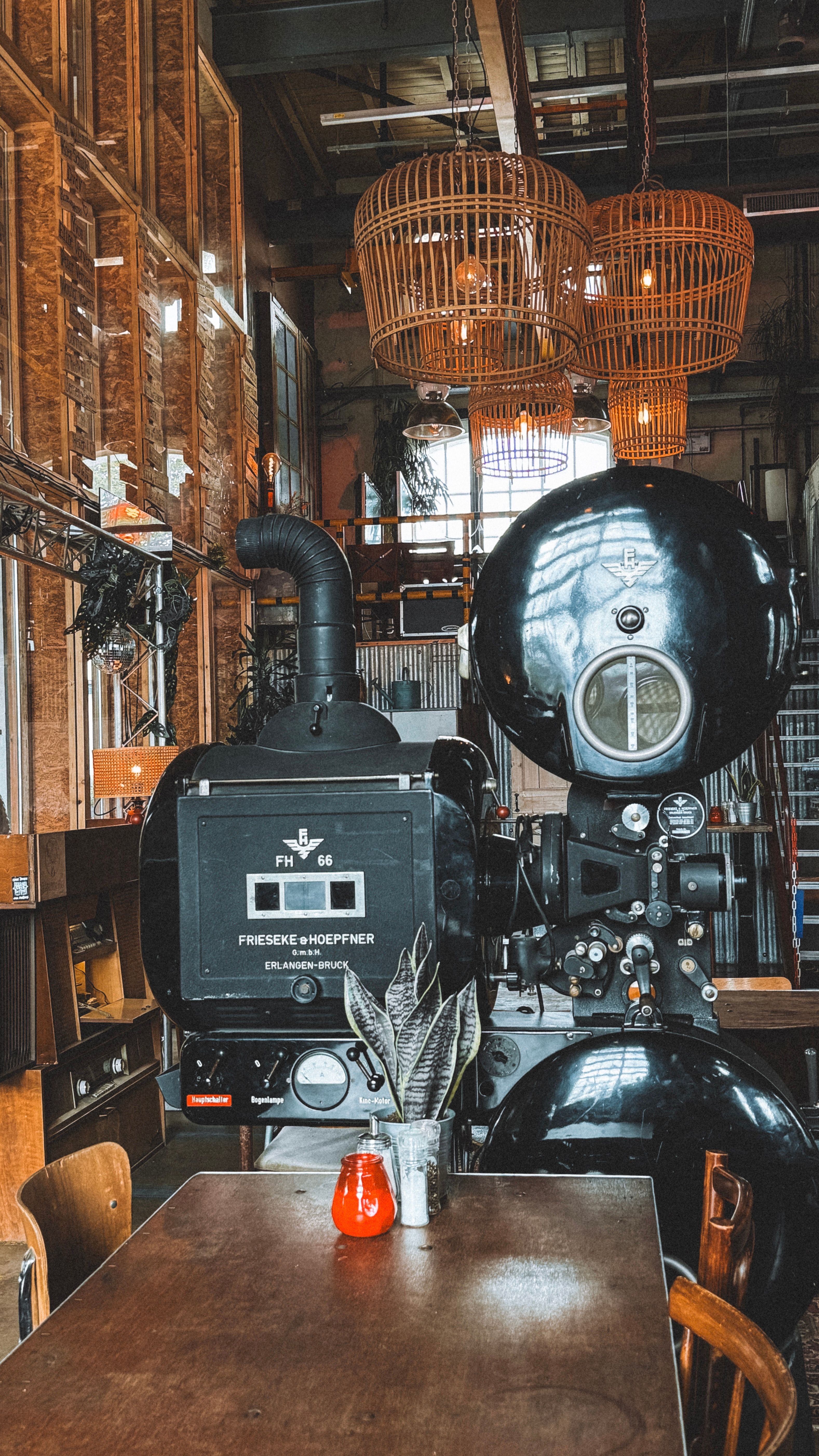 Vintage industrial equipment in a chic Tilburg cafe setting with unique decor.