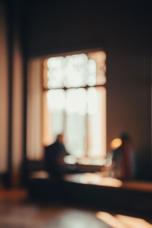 Free Abstract photo with warm tones showing silhouettes by a window in İstanbul. Stock Photo