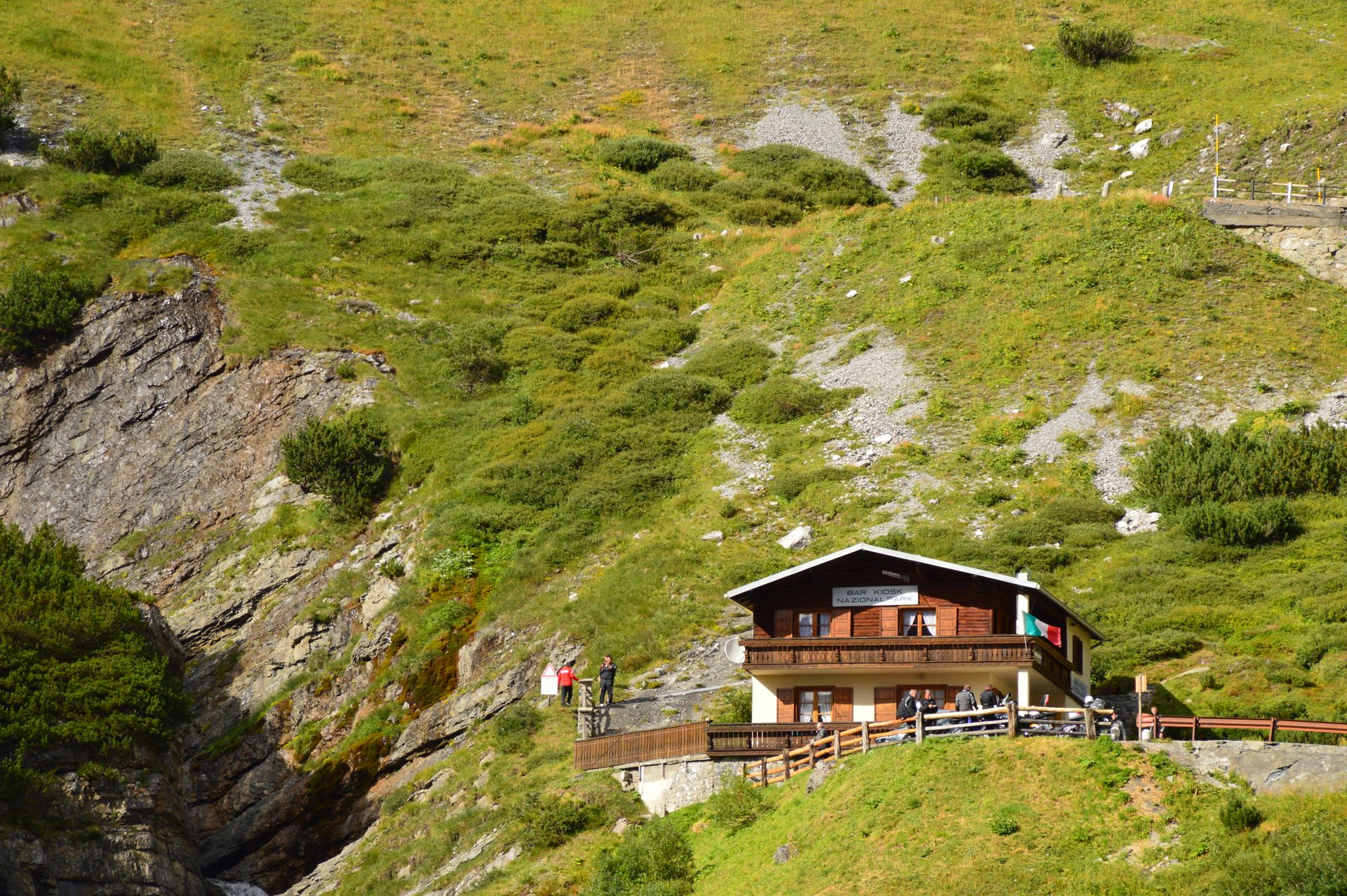 A remote mountain lodge nestled in lush greenery, ideal for nature lovers.