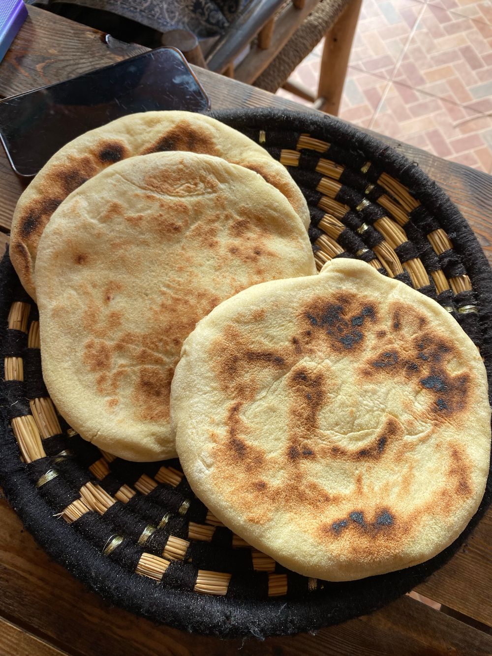 Fresh flatbreads in a woven basket
