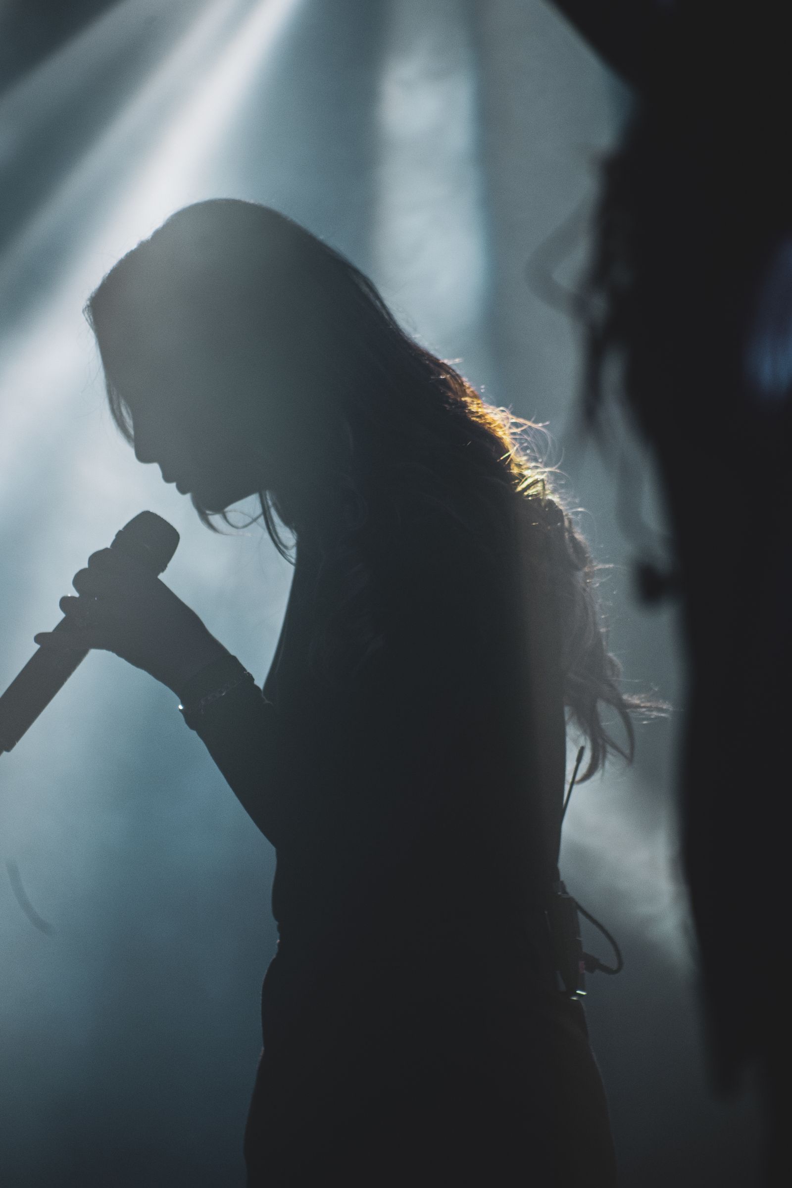 Performer in a beam of light