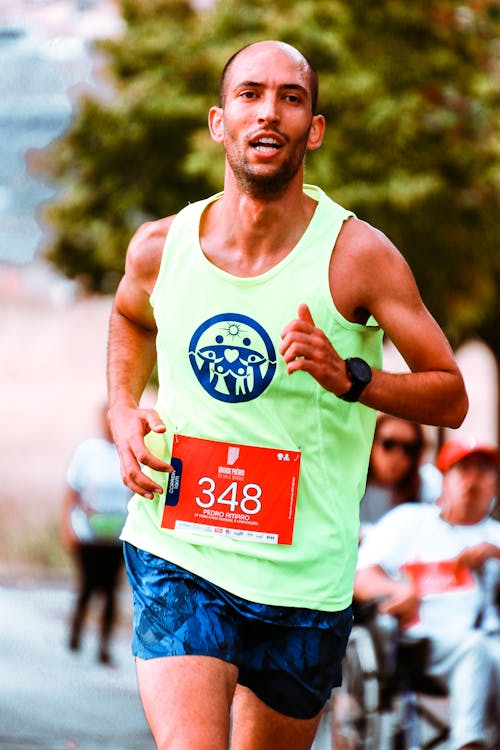 Shallow Focus Photo of Man In Active Sports Wear Running