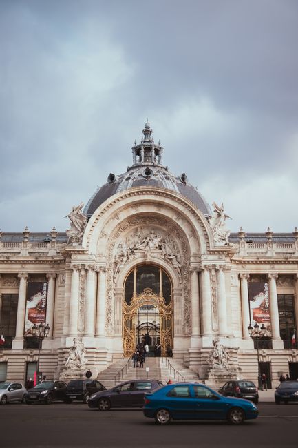 Elegant facade of Petit Palais in Paris captured on a cloudy day, showcasing its grand architecture.