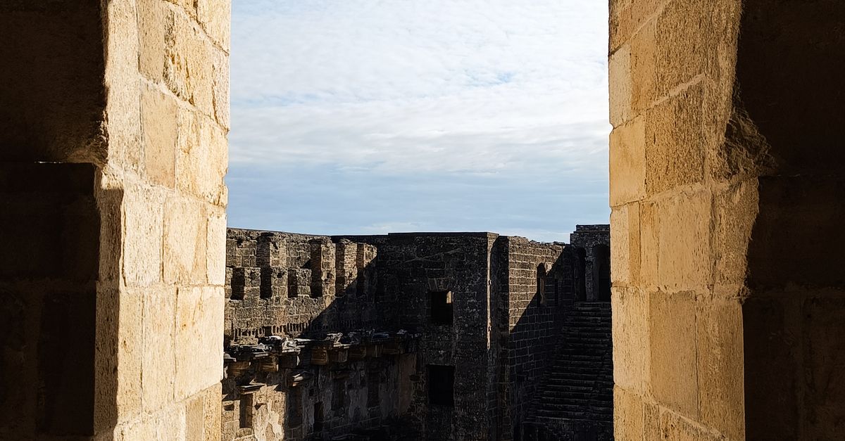 Ancient Stone Archway Overlooking Roman Theater · Free Stock Photo