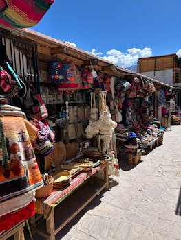 Bustling outdoor market showcasing colorful handmade crafts under a bright sky.