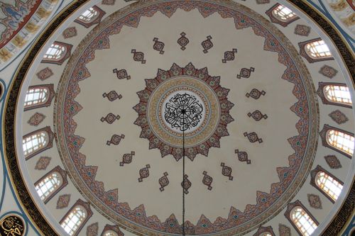 Free Decorative dome with Islamic patterns and calligraphy, featuring vibrant stained glass. Stock Photo